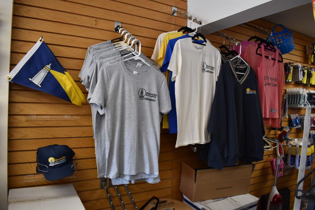 T-shirts hung on a wall for display