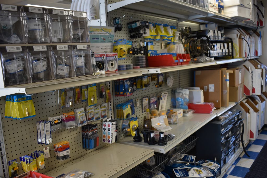 Shelf containing hoses and other parts